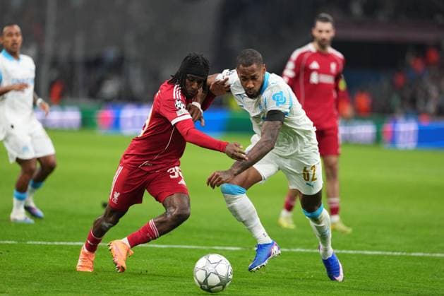 Jeremie Frimpong of Liverpool takes on Geoffrey Kondogbia of Marseille Marseille v Liverpool, UEFA Champions League, Group Stage, Football, Orange Velodrome, Marseille, France - 21 Jan 2026Marseille Orange Vélodrome France EDITORIAL USE ONLY No use with unauthorised audio, video, data, fixture lists, club league logos or live services. Online in-match use limited to 120 images, no video emulation. No use in betting, games or single club league player publications. Copyright: xDavexWinter Shutterstockx 16348361dp