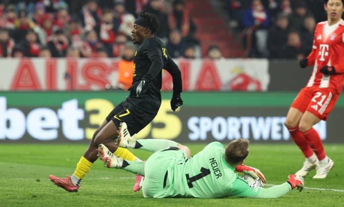 Union s Mohammed Fuseini and Bayern s goalkeeper Manuel Neuer fight for the ball during a soccer game between German FC Bayern Munich and Belgian Royale Union Saint-Gilloise, on Wednesday 21 January 2026 in Munich, on the seventh day of the League phase of the UEFA Champions League tournament. VIRGINIExLEFOUR  x157574256x