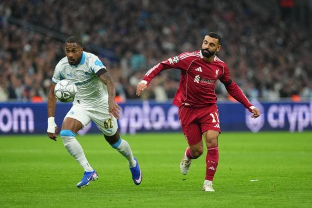 Mohamed Salah of Liverpool battles with Michael Murillo of Marseille Marseille v Liverpool, UEFA Champions League, Group Stage, Football, Orange Velodrome, Marseille, France - 21 Jan 2026Marseille Orange Vélodrome France EDITORIAL USE ONLY No use with unauthorised audio, video, data, fixture lists, club league logos or live services. Online in-match use limited to 120 images, no video emulation. No use in betting, games or single club league player publications. Copyright: xDavexWinter Shutterstockx 16348361ih