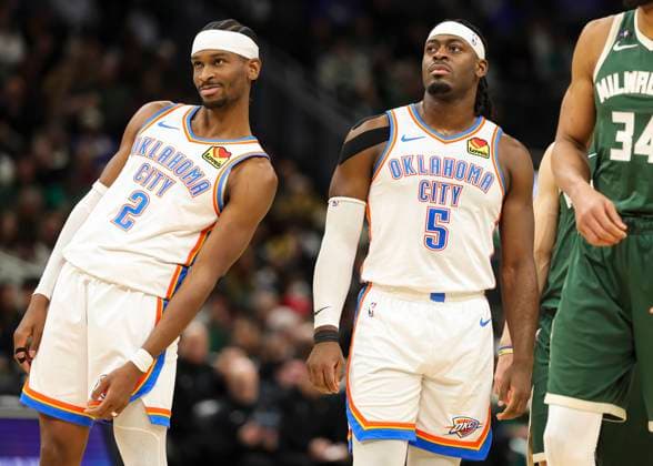 (260122) -- MILWAUKEE, Jan. 22, 2026 -- Oklahoma City Thunder s Shai Gilgeous-Alexander (L) and Luguentz Dort react during the 2025-2026 NBA, Basketball Herren, USA regular season game between Milwaukee Bucks and Oklahoma City Thunder in Milwaukee, the United States, Jan. 21, 2026. (Photo by Xinhua) (SP)U.S.-MILWAUKEE-BASKETBALL-NBA-BUCKS VS THUNDER JoelxLerner 