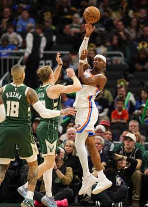 (260122) -- MILWAUKEE, Jan. 22, 2026 -- Oklahoma City Thunder s Shai Gilgeous-Alexander (R) throws a pass during the 2025-2026 NBA, Basketball Herren, USA regular season game between Milwaukee Bucks and Oklahoma City Thunder in Milwaukee, the United States, Jan. 21, 2026. (Photo by Xinhua) (SP)U.S.-MILWAUKEE-BASKETBALL-NBA-BUCKS VS THUNDER JoelxLerner 