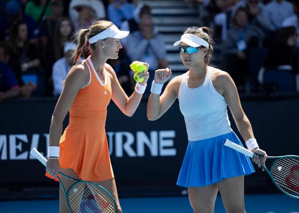 (260122) -- MELBOURNE, Jan. 22, 2026 -- Guo Hanyu (R) Kristina Mladenovic react during the women s doubles 1st round match between Guo Hanyu (China) Kristina Mladenovic (France) and Alycia Parks (the United States) Dayana Yastremska (Ukraine) at the Australian Open tennis tournament in Melbourne, Australia, Jan. 22, 2026. (Photo by Xinhua) (SP)AUSTRALIA-MELBOURNE-TENNIS-AUSTRALIAN OPEN-WOMEN S DOUBLES HuxJingchen 