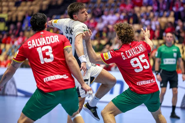 22 01 2026, Handball, Men s EHF EURO 2026, Germany Portugal, Jyske Bank Boxing in Herning, Denmark, Main Round Renars Uscins Germany 23 in duel against Rocha Nogueira Portugal 13 Gabriel Oliveira Cavalcanti Portugal 95 Denmark