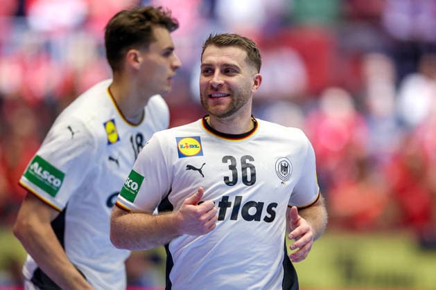 22 01 2026, Handball, Men s EHF EURO 2026, Germany Portugal, Jyske Bank Boxen in Herning, Denmark, Main Round Lukas Mertens Germany 36 laughing next to Julian Köster Germany 18 Denmark