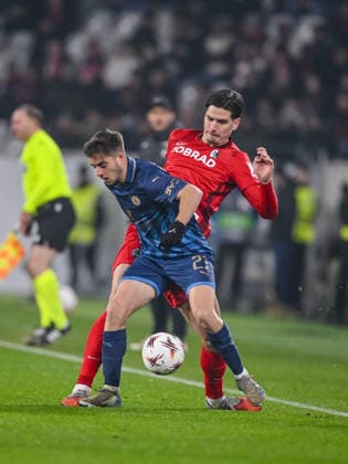 Noam Ben Harosh Maccabi Tel Aviv FC and Igor MatanoviÄ‡ SC Freiburg battle for the ball during the UEFA Europa League 2025 26 League Phase MD7 match between SC Freiburg and Maccabi Tel Aviv FC at Stadion am Wolfswinkel on January 22, 2026 in Freiburg im Breisgau, Germany Photo by Harry Langer DeFodi Images