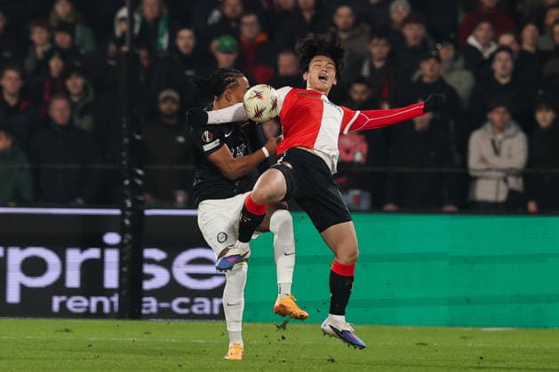 2026-01-22 Feyenoord v SK Sturm Graz - UEFA Europa League, League phase, MD7 ROTTERDAM, NETHERLANDS - JANUARY 22: Ayase Ueda of Feyenoordis tackled byEmanuel Aiwu of SK Sturm Graz during the UEFA Europa League, League phase, MD7 match between Feyenoord and SK Sturm Graz at Stadion Feijenoord on January 22, 2026 in Rotterdam, Netherlands. Rotterdam Stadion Feijenoord Netherlands Content not available for redistribution in The Netherlands directly or indirectly through any third parties. Copyright: xHansxvanxderxValkx