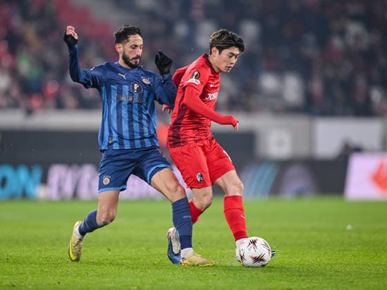 Sagiv Jehezkel Maccabi Tel Aviv FC and Yuito Suzuki SC Freiburg battle for the ball during the UEFA Europa League 2025 26 League Phase MD7 match between SC Freiburg and Maccabi Tel Aviv FC at Stadion am Wolfswinkel on January 22, 2026 in Freiburg im Breisgau, Germany Photo by Harry Langer DeFodi Images