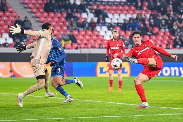 Goalkeeper Roi Mihpati Maccabi Tel Aviv FC and Igor MatanoviÄ‡ SC Freiburg battle for the ball during the UEFA Europa League 2025 26 League Phase MD7 match between SC Freiburg and Maccabi Tel Aviv FC at Stadion am Wolfswinkel on January 22, 2026 in Freiburg im Breisgau, Germany Photo by Harry Langer DeFodi Images