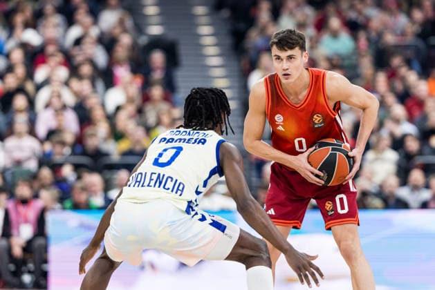 MUNICH, GERMANY - JANUARY 22: Neno Dimitrijevic (FC Bayern Muenchen, 0) controls the ball against Brancou Badio (Valencia Basket, 0) during the Turkish Airlines EuroLeague match between FC Bayern Muenchen vs. Valencia Basket at SAP Garden on round 24 of Turkish Airlines EuroLeague on January 22, 2026 in Munich, Germany. Bavaria Germany Copyright: xSteffiexWunderlx