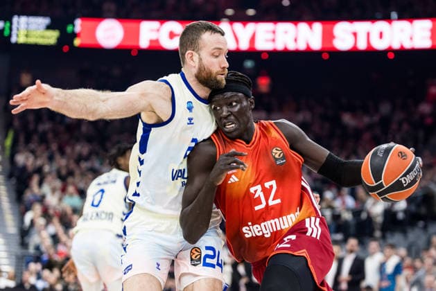 MUNICH, GERMANY - JANUARY 22: Wenyen Gabriel (FC Bayern Muenchen, 32) controls the ball against Matthew Costello (Valencia Basket, 24) during the Turkish Airlines EuroLeague match between FC Bayern Muenchen vs. Valencia Basket at SAP Garden on round 24 of Turkish Airlines EuroLeague on January 22, 2026 in Munich, Germany. Bavaria Germany Copyright: xSteffiexWunderlx