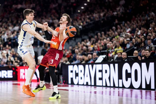 MUNICH, GERMANY - JANUARY 22: Andreas Andi Obst (FC Bayern Muenchen, 13) is being fouled by Sergio De Larrea (Valencia Basket, 5) and sent flying during the Turkish Airlines EuroLeague match between FC Bayern Muenchen vs. Valencia Basket at SAP Garden on round 24 of Turkish Airlines EuroLeague on January 22, 2026 in Munich, Germany. Bavaria Germany Copyright: xSteffiexWunderlx