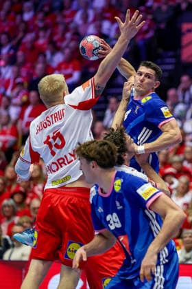 22 01 2026, Handball, Men s EHF EURO 2026, France Denmark, Jyske Bank Boxen in Herning, Denmark, Main Round Magnus Saugstrup Jensen Denmark 15 and Niclas Vest Kirkelokke Denmark 03 in a duel against Aymeric Minne France 04 Denmark
