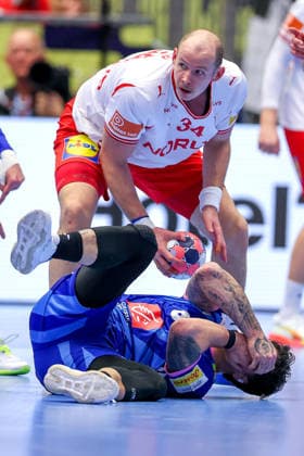 22 01 2026, Handball, Men s EHF EURO 2026, France Denmark, Jyske Bank Boxen in Herning, Denmark, Main Round Simon Hald Jensen Denmark 34 next to Elohim Prandi France 08 lying on the ground Denmark