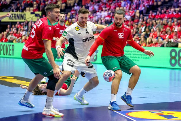 22 01 2026, Handball, Men s EHF EURO 2026, Germany Portugal, Jyske Bank Boxing in Herning, Denmark, Main Round Johannes Golla Germany 04 in a duel against Francisco Mota Costa Portugal 26 Luis Diogo Sousa Frade Portugal 82 Denmark