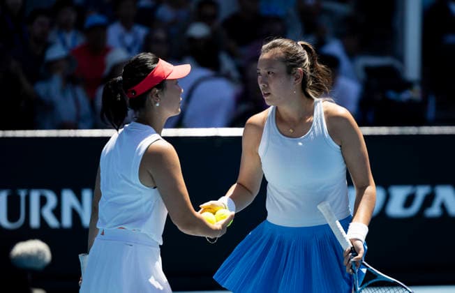 (260123) -- MELBOURNE, Jan. 23, 2026 -- Xu Yifan(L) Yang Zhaoxuan of China react during the women s doubles 2nd round match against Taylor Townsend (the United States) Katerina Siniakova (the Czech Republic) at the Australian Open tennis tournament in Melbourne, Australia, Jan. 23, 2026. (Photo by Xinhua) (SP)AUSTRALIA-MELBOURNE-TENNIS-AUSTRALIAN OPEN-WOMEN S DOUBLES HuxJingchen 