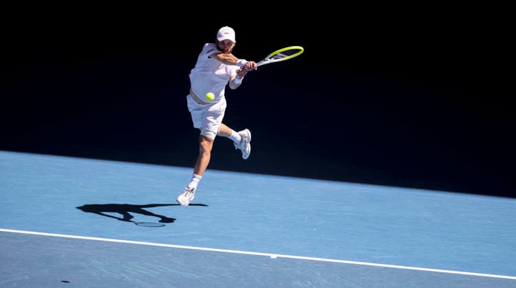 (260123) -- MELBOURNE, Jan. 23, 2026 -- Corentin Moutet of France hits a return during the men s singles 3rd round match against Carlos Alcaraz of Spain at the Australian Open tennis tournament in Melbourne, Australia, Jan. 23, 2026. (Photo by Xinhua) (SP)AUSTRALIA-MELBOURNE-TENNIS-AUSTRALIAN OPEN-MEN S SINGLES HuxJingchen 