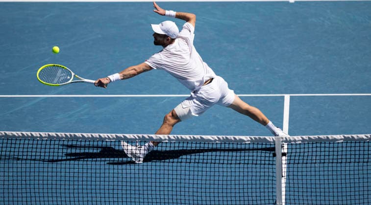 (260123) -- MELBOURNE, Jan. 23, 2026 -- Corentin Moutet of France hits a return during the men s singles 3rd round match against Carlos Alcaraz of Spain at the Australian Open tennis tournament in Melbourne, Australia, Jan. 23, 2026. (Photo by Xinhua) (SP)AUSTRALIA-MELBOURNE-TENNIS-AUSTRALIAN OPEN-MEN S SINGLES HuxJingchen 