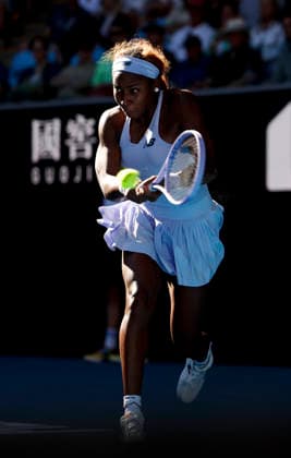 (260123) -- MELBOURNE, Jan. 23, 2026 -- Coco Gauff of the United States hits a return during the women s singles 3rd round match against Hailey Baptiste of the United States at the Australian Open tennis tournament in Melbourne, Australia, Jan. 23, 2026. ) (SP)AUSTRALIA-MELBOURNE-TENNIS-AUSTRALIAN OPEN-WOMEN S SINGLES MaxPing 