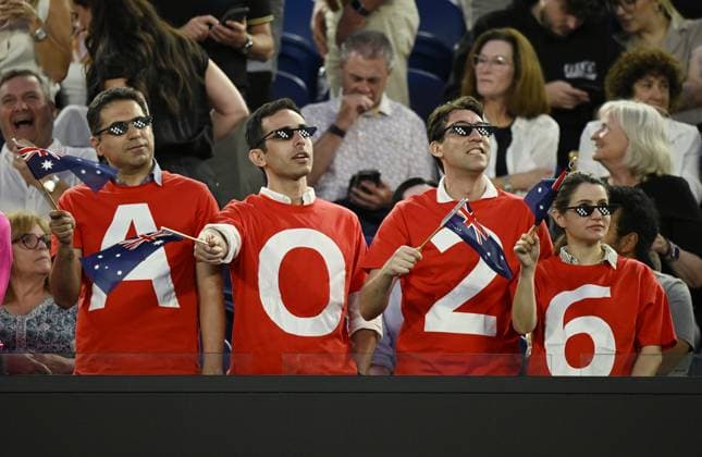 (260123) -- MELBOURNE, Jan. 23, 2026 -- Spectators wave flags during the men s singles 3rd round match between Alex de Minaur of Australia and Frances Tiafoe of the United States at the Australian Open tennis tournament in Melbourne, Australia, Jan. 23, 2026. (Photo by Xinhua) (SP)AUSTRALIA-MELBOURNE-TENNIS-AUSTRALIAN OPEN-MEN S SINGLES WangxShen 