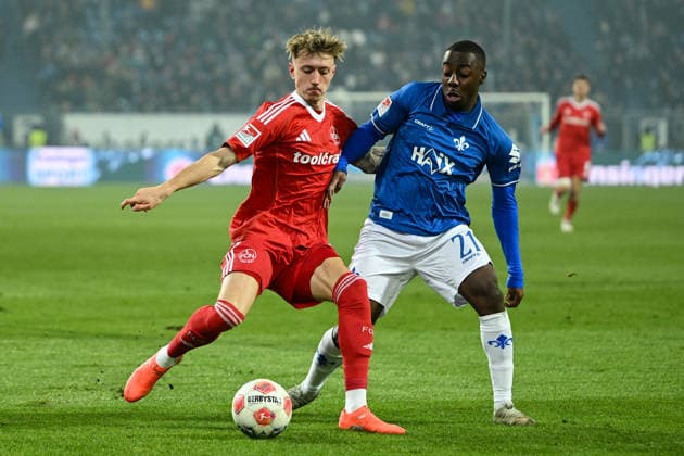Tim Drexler 1 FC Nürnberg, 15 in duel with Merveille Papela SV Darmstadt 1898, 21 , GER, SV Darmstadt 98 vs 1 FC Nürnberg, Soccer, 2 Bundesliga, Matchday 19, Season 2025 2026, 23 01 2026 DFL REGULATIONS PROHIBIT ANY USE OF PHOTOGRAPHS AS IMAGE SEQUENCES AND OR QUASI VIDEO GER, SV Darmstadt 98 vs 1 FC Nürnberg, Soccer, 2 Bundesliga, Matchday 19, Season 2025 2026, 23 01 2026 Darmstadt Copyright: xEibner-Pressefoto FlorianxWiegandx EP_FWD
