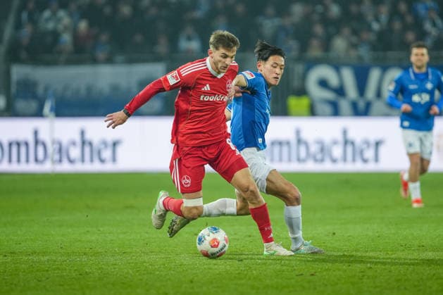 Soccer 2 Bundesliga, Matchday 19, SV Darmstadt 98 1 FC Nürnberg on 23 01 2026 in Darmstadt Merck Stadion am Böllenfalltor , Germany, Season 2025 2026 DFB DFL REGULATIONS PROHIBIT ANY USE OF PHOTOGRAPHS as IMAGE SEQUENCES and or QUASI VIDEO Adam Markhiyev 6, FCN in duel with Hiroki Akiyama 16, SVD Darmstadt Merck Stadion am Böllenfalltor Germany Copyright: xChristophxKinzingerx