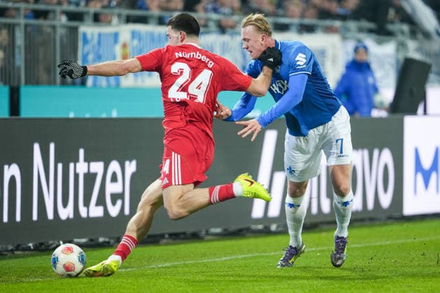 Soccer 2 Bundesliga, Matchday 19, SV Darmstadt 98 1 FC Nürnberg on 23 01 2026 in Darmstadt Merck Stadion am Böllenfalltor , Germany, Season 2025 2026 DFB DFL REGULATIONS PROHIBIT ANY USE OF PHOTOGRAPHS as IMAGE SEQUENCES and or QUASI VIDEO Luka Lochoshvili 24, FCN in duel with Isac Alexi Sivert Lidberg 7, SVD Darmstadt Merck Stadion am Böllenfalltor Germany Copyright: xChristophxKinzingerx