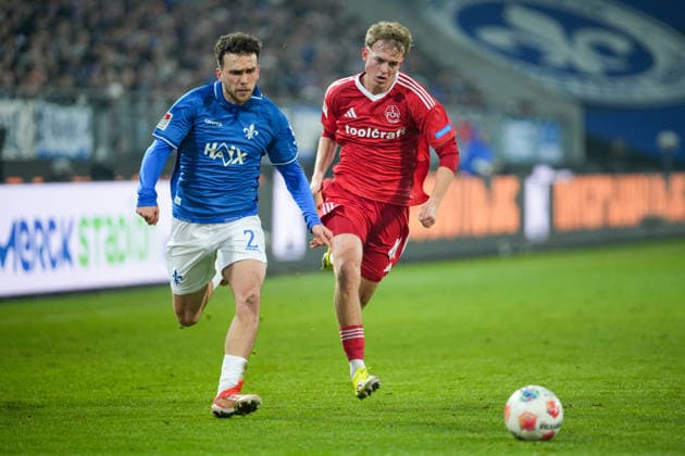 Soccer 2 Bundesliga, Matchday 19, SV Darmstadt 98 1 FC Nürnberg on 23 01 2026 in Darmstadt Merck Stadion am Böllenfalltor , Germany, Season 2025 2026 DFB DFL REGULATIONS PROHIBIT ANY USE OF PHOTOGRAPHS as IMAGE SEQUENCES and or QUASI VIDEO Sergio Lopez 2, SVD in duel with Eric Porstner 41, FCN Darmstadt Merck Stadion am Böllenfalltor Germany Copyright: xChristophxKinzingerx