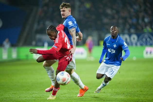 Soccer 2 Bundesliga, Matchday 19, SV Darmstadt 98 1 FC Nürnberg on 23 01 2026 in Darmstadt Merck Stadion am Böllenfalltor , Germany, Season 2025 2026 DFB DFL REGULATIONS PROHIBIT ANY USE OF PHOTOGRAPHS as IMAGE SEQUENCES and or QUASI VIDEO Mohamed Ali Zoma 23, FCN in duel with Matej Maglica 5, SVD , in the background is Matondo Merveille Papela 21, SVD Darmstadt Merck Stadion am Böllenfalltor Germany Copyright: xChristophxKinzingerx