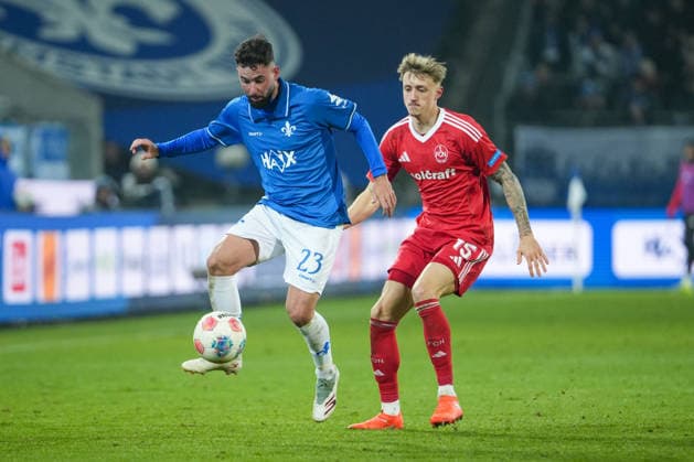 Soccer 2 Bundesliga, Matchday 19, SV Darmstadt 98 1 FC Nürnberg on 23 01 2026 in Darmstadt Merck Stadion am Böllenfalltor , Germany, Season 2025 2026 DFB DFL REGULATIONS PROHIBIT ANY USE OF PHOTOGRAPHS as IMAGE SEQUENCES and or QUASI VIDEO Marco Richter 23, SVD in duel with Tim Drexler 15, FCN Darmstadt Merck Stadion am Böllenfalltor Germany Copyright: xChristophxKinzingerx