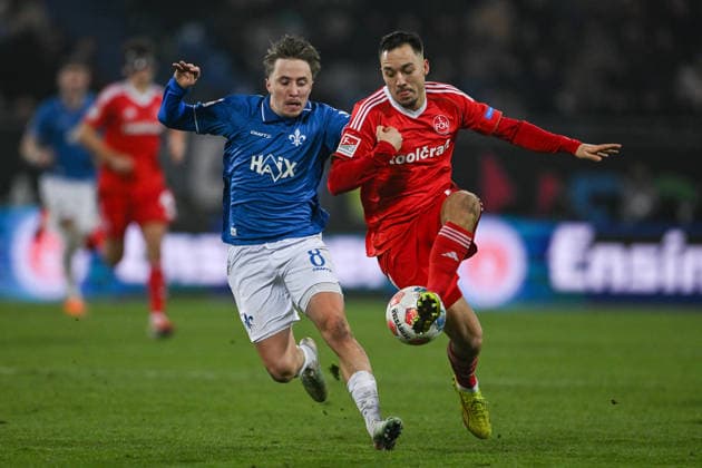 Luca Marseiler SV Darmstadt 1898, 08 in duel with Julian Justvan 1 FC Nürnberg, 10 , GER, SV Darmstadt 98 vs 1 FC Nürnberg, Soccer, 2 Bundesliga, Matchday 19, Season 2025 2026, 23 01 2026 DFL REGULATIONS PROHIBIT ANY USE OF PHOTOGRAPHS AS IMAGE SEQUENCES AND OR QUASI VIDEO GER, SV Darmstadt 98 vs 1 FC Nürnberg, Soccer, 2 Bundesliga, Matchday 19, Season 2025 2026, 23 01 2026 Darmstadt Copyright: xEibner-Pressefoto FlorianxWiegandx EP_FWD