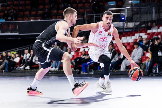 MUNICH, GERMANY - JANUARY 23: Yam Madar (Hapoel IBI Tel Aviv, 26) controls the ball against Vanja Marinkovic (Partizan Mozzart Bet Belgrade, 9) during the Turkish Airlines EuroLeague match between Partizan Mozzart Bet Belgrade vs. Hapoel IBI Tel Aviv at BMW Park on round 24 of Turkish Airlines EuroLeague on January 23, 2026 in Munich, Germany. Bavaria Germany Copyright: xSteffiexWunderlx