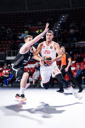 MUNICH, GERMANY - JANUARY 23: Yam Madar (Hapoel IBI Tel Aviv, 26) controls the ball against Vanja Marinkovic (Partizan Mozzart Bet Belgrade, 9) during the Turkish Airlines EuroLeague match between Partizan Mozzart Bet Belgrade vs. Hapoel IBI Tel Aviv at BMW Park on round 24 of Turkish Airlines EuroLeague on January 23, 2026 in Munich, Germany. Bavaria Germany Copyright: xSteffiexWunderlx