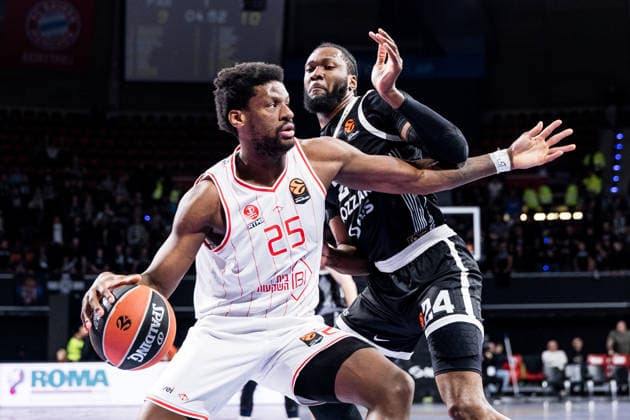 MUNICH, GERMANY - JANUARY 23: Dan Oturu (Hapoel IBI Tel Aviv, 25) controls the ball against Bruno Fernando (Partizan Mozzart Bet Belgrade, 24) during the Turkish Airlines EuroLeague match between Partizan Mozzart Bet Belgrade vs. Hapoel IBI Tel Aviv at BMW Park on round 24 of Turkish Airlines EuroLeague on January 23, 2026 in Munich, Germany. Bavaria Germany Copyright: xSteffiexWunderlx