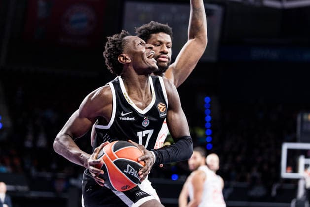 MUNICH, GERMANY - JANUARY 23: Isaac Bonga (Partizan Mozzart Bet Belgrade, 17) controls the ball against Dan Oturu (Hapoel IBI Tel Aviv, 25) during the Turkish Airlines EuroLeague match between Partizan Mozzart Bet Belgrade vs. Hapoel IBI Tel Aviv at BMW Park on round 24 of Turkish Airlines EuroLeague on January 23, 2026 in Munich, Germany. Bavaria Germany Copyright: xSteffiexWunderlx