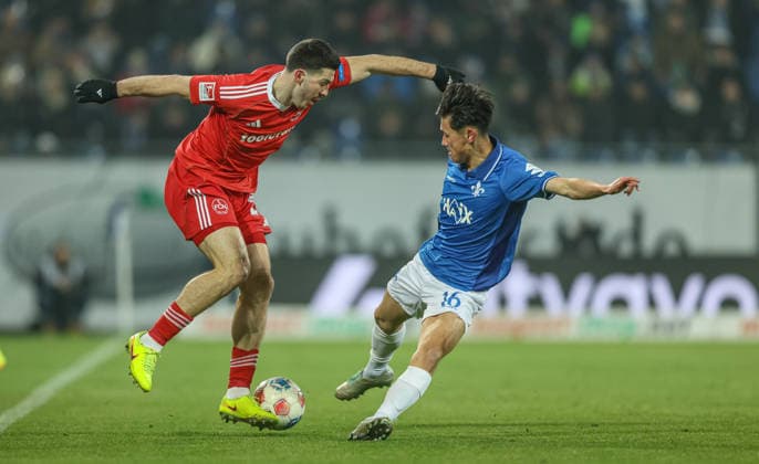 GER, Darmstadt, SV Darmstadt 98 vs 1 FC Nürnberg, 2 Bundesliga, Football, DFB, Season 2025 2026, Merck Stadion am Böllenfalltor, 19 Matchday in picture f l Luka Lochoshvili 1 FC Nürnberg 24 , Hiroki Akiyama SV Darmstadt 98 DFB DFL REGULATIONS PROHIBIT ANY USE OF PHOTOGRAPHS AS IMAGE SEQUENCES AND OR QUASI VIDEO, 23 01 2026 Copyright: HMBxMedia HendrikxHamelau