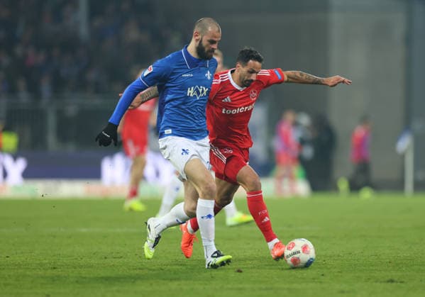 23 01 2026, Soccer 2 Bundesliga, SV Darmstadt 98 1 FC Nürnberg, emonline, emspor, despor, v l , Aleksandar Vukotic SV Darmstadt 98 , Adriano Grimaldi 1 FC Nürnberg DFL DFB REGULATIONS PROHIBIT ANY USE OF PHOTOGRAPHS AS IMAGE SEQUENCES AND OR QUASI VIDEO xdcx Copyright: HMBxMedia Claus