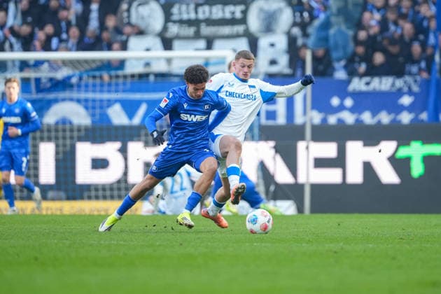 Soccer 2 Bundesliga, Matchday 19, Karlsruher SC Hertha BSC on 24 01 2026 in Karlsruhe BBBank Wildpark , Germany, Season 2025 2026 DFB DFL REGULATIONS PROHIBIT ANY USE OF PHOTOGRAPHS as IMAGE SEQUENCES and or QUASI VIDEO Louey Ben Farhat 19, KSC in duel with Michael Bruno Dominique Cuisance 10, BSC Karlsruhe BBBank Wildpark Germany Copyright: xChristophxKinzingerx