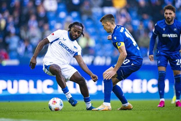 Marvin Wanitzek 10 Karlsruher SC in duel with Deyovaisio Zeefuik 42 Hertha BSC duel for the ball Copyright: xspeedshotx