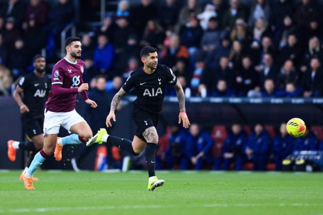 Burnley, England, 24th January 2026. Cristian Romero of Tottenham Hotspur runs with the ball whilst under pressure from Armando Broja of Burnley during the Burnley vs Tottenham Hotspur Premier League match at Turf Moor, Burnley. Picture credit should read: Jessica Hornby Sportimage EDITORIAL USE ONLY. No use with unauthorised audio, video, data, fixture lists, club league logos or live services. Online in-match use limited to 120 images, no video emulation. No use in betting, games or single club league player publications. SPI_030_JH_BURNLEY_TOTTENHAM SPI-4474-0029