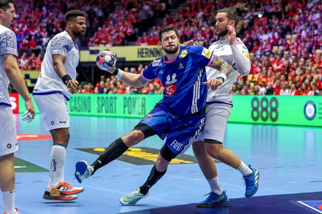 24 01 2026, Handball, Men s EHF EURO 2026, France Portugal, Jyske Bank Boxing in Herning, Denmark, Main Round Nicolas Tournat France 11 in duel against Rocha Nogueira Portugal 13 Victor Manuel Iturriza Alvarez Portugal 08 Luis Diogo Sousa Frade Portugal 82 Denmark