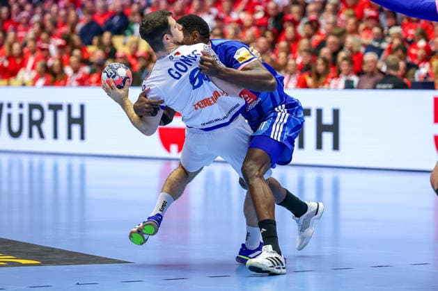 24 01 2026, Handball, Men s EHF EURO 2026, France Portugal, Jyske Bank Boxing in Herning, Denmark, Main Round Joao Pedro Vinhas Silva Gomes Portugal 66 is pinned down by Karl Konan France 34 Denmark