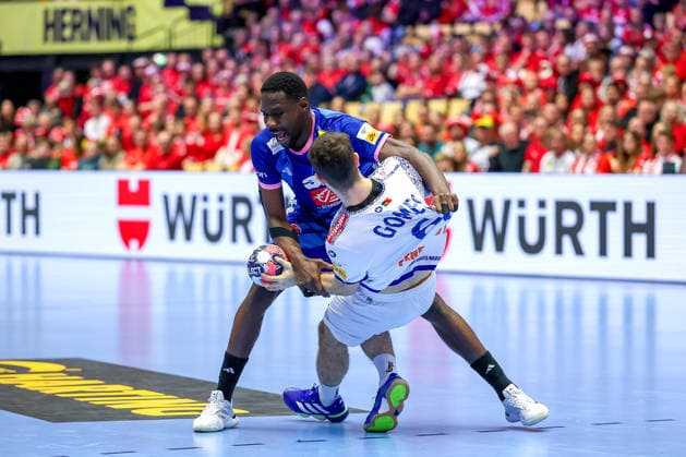 24 01 2026, Handball, Men s EHF EURO 2026, France Portugal, Jyske Bank Boxing in Herning, Denmark, Main Round Joao Pedro Vinhas Silva Gomes Portugal 66 is pinned down by Karl Konan France 34 Denmark