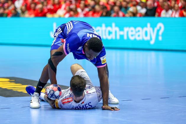 24 01 2026, Handball, Men s EHF EURO 2026, France Portugal, Jyske Bank Boxing in Herning, Denmark, Main Round Joao Pedro Vinhas Silva Gomes Portugal 66 is pinned down by Karl Konan France 34 Denmark