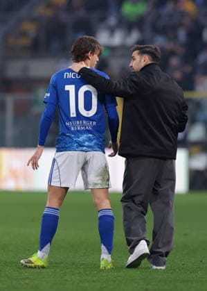 Como, Italy, 24th January 2026. Cesc Fabregas Head coach of Como 1907 embraces Nico Paz of Como 1907 during the Como 1907 vs Torino Serie A match at Stadio Giuseppe Sinigaglia, Como. Picture credit should read: Jonathan Moscrop Sportimage EDITORIAL USE ONLY. No use with unauthorised audio, video, data, fixture lists, club league logos or live services. Online in-match use limited to 120 images, no video emulation. No use in betting, games or single club league player publications. SPI_074_JM_COMO_TORO_ SPI-4418-0073