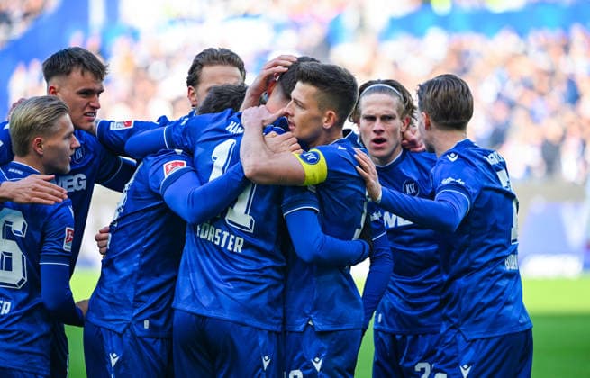 Marvin Wanitzek Karlsruher SC celebrates his team s goal with Paul Scholl Karlsruher SC , David Herold Karlsruher SC and Andreas Mueller Karlsruher SC during the 2 Bundesliga match between Karlsruher SC and Hertha BSC at BBBank Wildpark on January 24, 2026 in Karlsruhe, Germany Photo by Silas Schüller DeFodi Images Marvin Wanitzek Karlsruher SC celebrates his team s goal with Paul Scholl Karlsruher SC , David Herold Karlsruher SC and Andreas Mueller Karlsruher SC during the 2 Bundesliga match between Karlsruher SC and Hertha BSC at BBBank Wildpark on January 24, 2026 in Karlsruhe, Germany Photo by Silas Schüller DeFodi Images DFB DFL REGULATIONS PROHIBIT ANY USE OF PHOTOGRAPHS AS IMAGE SEQUENCES AND OR QUASI VIDEO Photo by Silas Schueller DeFodi Images