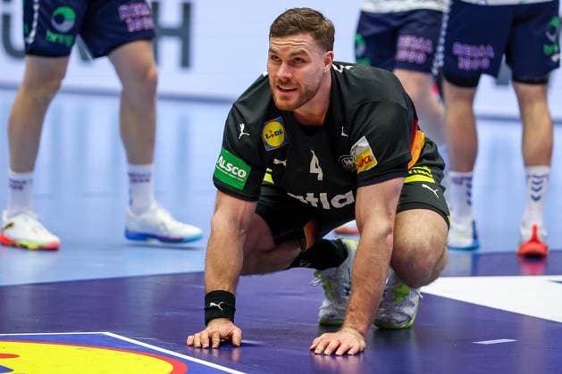 24 01 2026, Handball, Men s EHF EURO 2026, Germany Norway, Jyske Bank Boxen in Herning, Denmark, Main Round Johannes Golla Germany 04 kneels on the pitch Denmark
