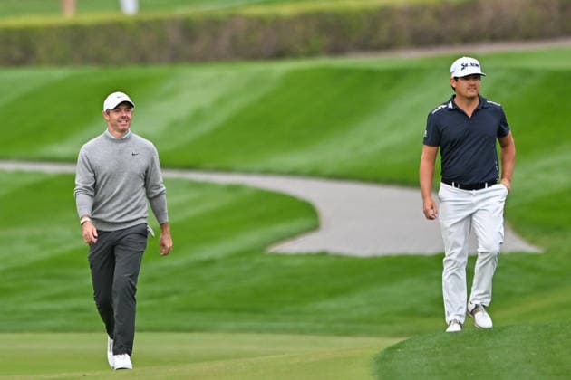 Hero Dubai Desert Classic 2026 in UAE DUBAI, UNITED ARAB EMIRATES - JANUARY 25: Northern Irish golfer Rory McIlroy (L) and Dutch golfer Darius van Driel (R) walk onto the course to compete in the fourth and final round of the Hero Dubai Desert Classic 2026 at Emirates Golf Club in Dubai, United Arab Emirates on January 25, 2026. Waleed Zein Anadolu Dubai United Arab Emirates. Editorial use only. Please get in touch for any other usage.  Copyright: x2026xAnadoluxWaleedxZeinx