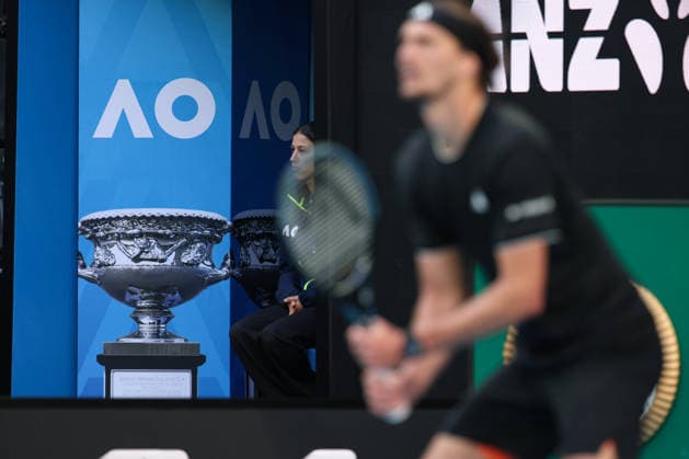 Alexander Zverev blurred in the foreground, behind him a picture of the trophy, Australian Open 2026, Melbourne Park, Melbourne, Victoria, Australia Copyright: xJuergenxHasenkopfx