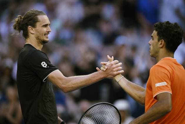 (260125) -- MELBOURNE, Jan. 25, 2026 -- Alexander Zverev (L) shake hands with Francisco Cerundolo after the men s singles 4th round match between Alexander Zverev of Germany and Francisco Cerundolo of Argentina at the Australian Open tennis tournament in Melbourne, Australia, Jan. 25, 2026. (Photo by Xinhua) (SP)AUSTRALIA-MELBOURNE-TENNIS-AUSTRALIAN OPEN-MEN S SINGLES WangxShen 