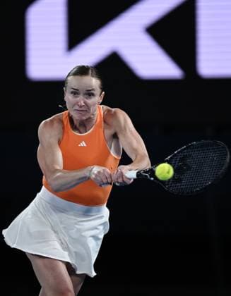 (260125) -- MELBOURNE, Jan. 25, 2026 -- Elina Svitolina hits a return during the women s singles 4th round match between Elina Svitolina of Ukraine and Mirra Andreeva of Russia at the Australian Open tennis tournament in Melbourne, Australia, Jan. 25, 2026. (Photo by Xinhua) (SP)AUSTRALIA-MELBOURNE-TENNIS-AUSTRALIAN OPEN-WOMEN S SINGLES WangxShen 